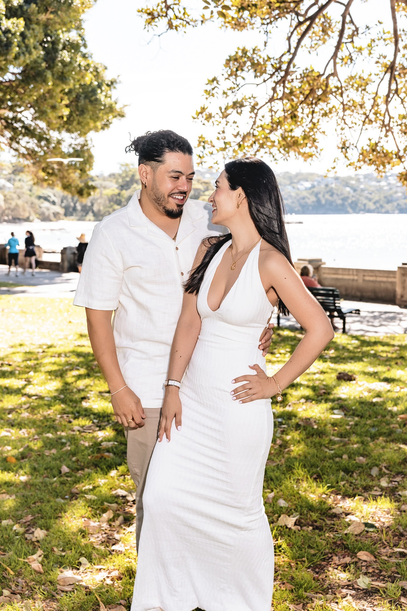 Angela and Harold laughing under a tree